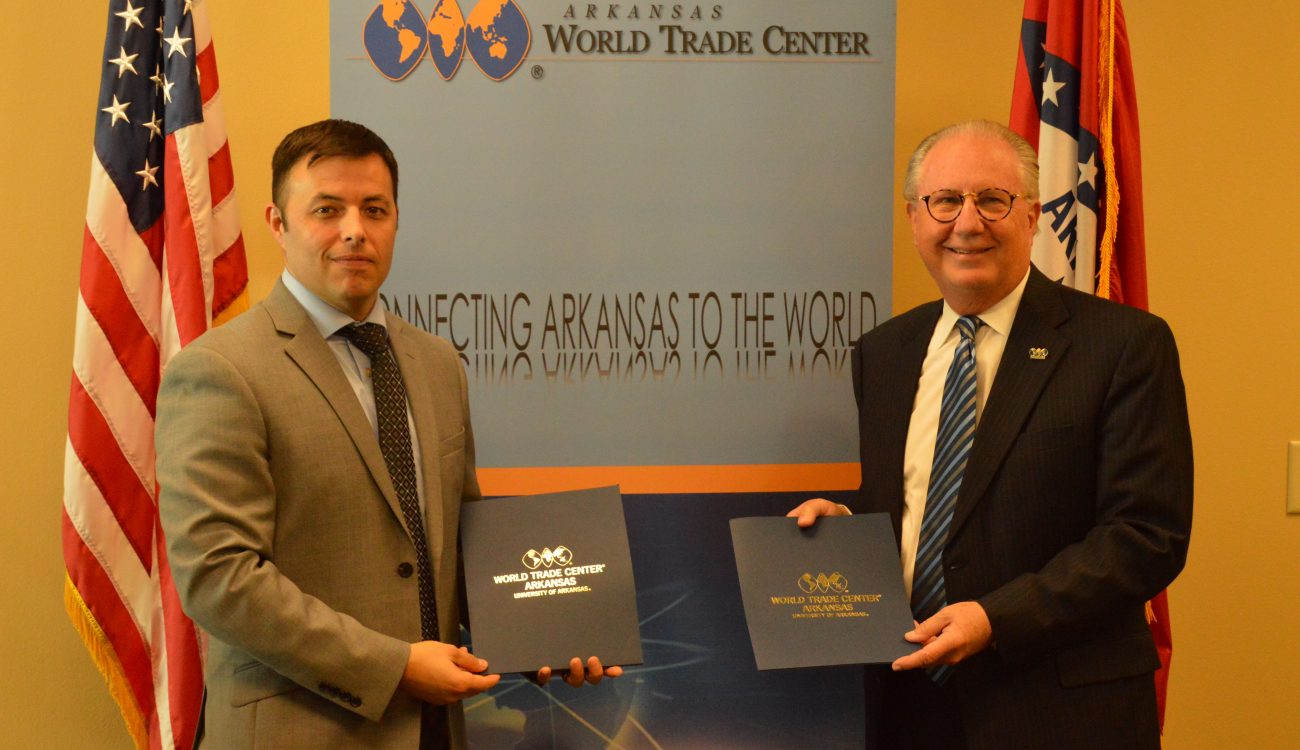 Small Business Administration Arkansas District Director Edward Haddock (left) stands with World Trade Center Arkansas President and CEO Dan Hendrix (right) after the signing of the Strategic Alliance Memorandum on Wednesday, October 10, 2018.