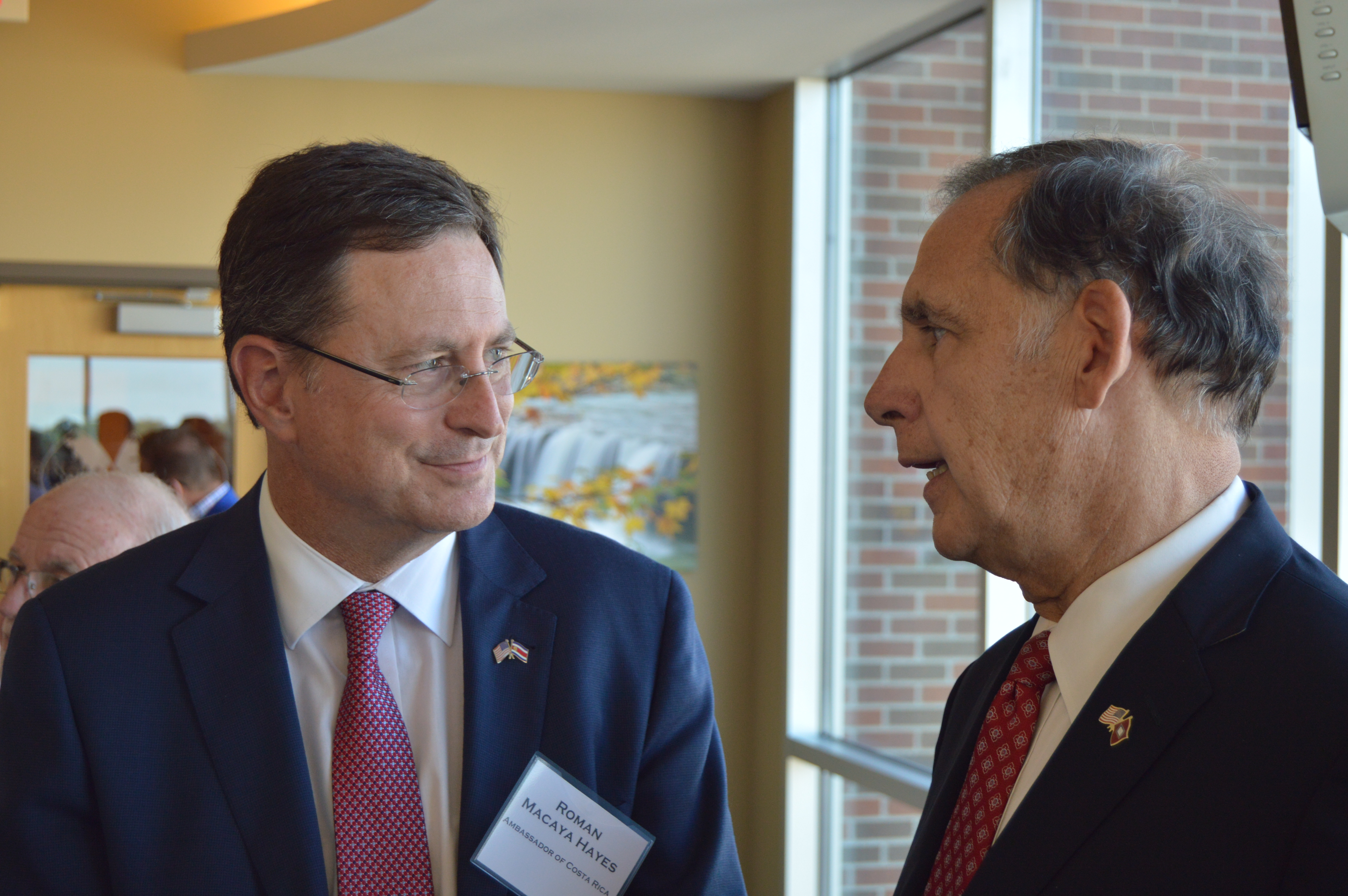 Ambassador Roman Macaya of Costa Rica listens to Senator John Boozman at the World Trade Center Arkansas 10 Year Anniversary Reception.