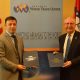 Small Business Administration Arkansas District Director Edward Haddock (left) stands with World Trade Center Arkansas President and CEO Dan Hendrix (right) after the signing of the Strategic Alliance Memorandum on Wednesday, October 10, 2018.