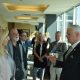Rep. Steve Womack visits with Tasha Sinclair of Lycus, Ltd.,Flip Kindberg of SkyGenie and Steve Cherry of Kanooler Products before the trade briefing at the World Trade Center Arkansas in Rogers.
